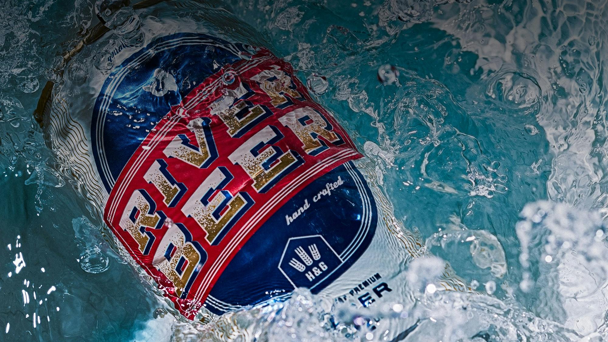 Beer splashing into water